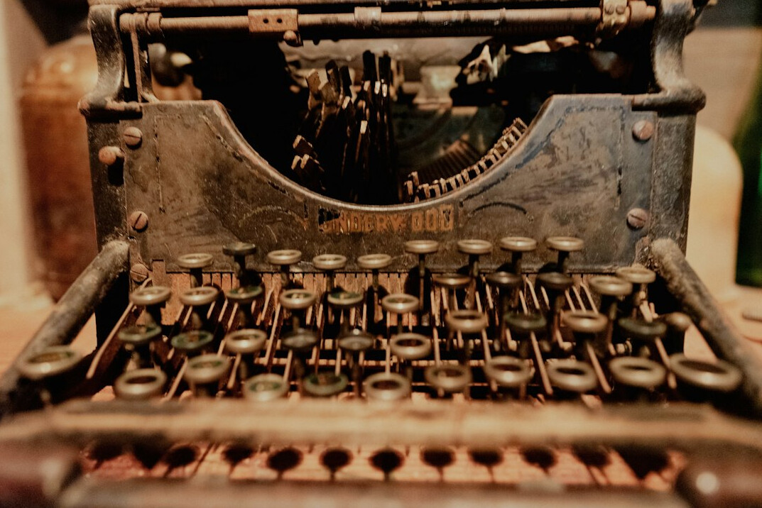 author writing by candlelight